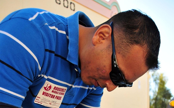 Sailor Builds Bulletin Board During Community Outreach Project
