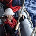 USS  George Washington Sailor Lowers RHIB