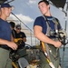 USS Framk Cable Sailors Check Air Hose Before Dive