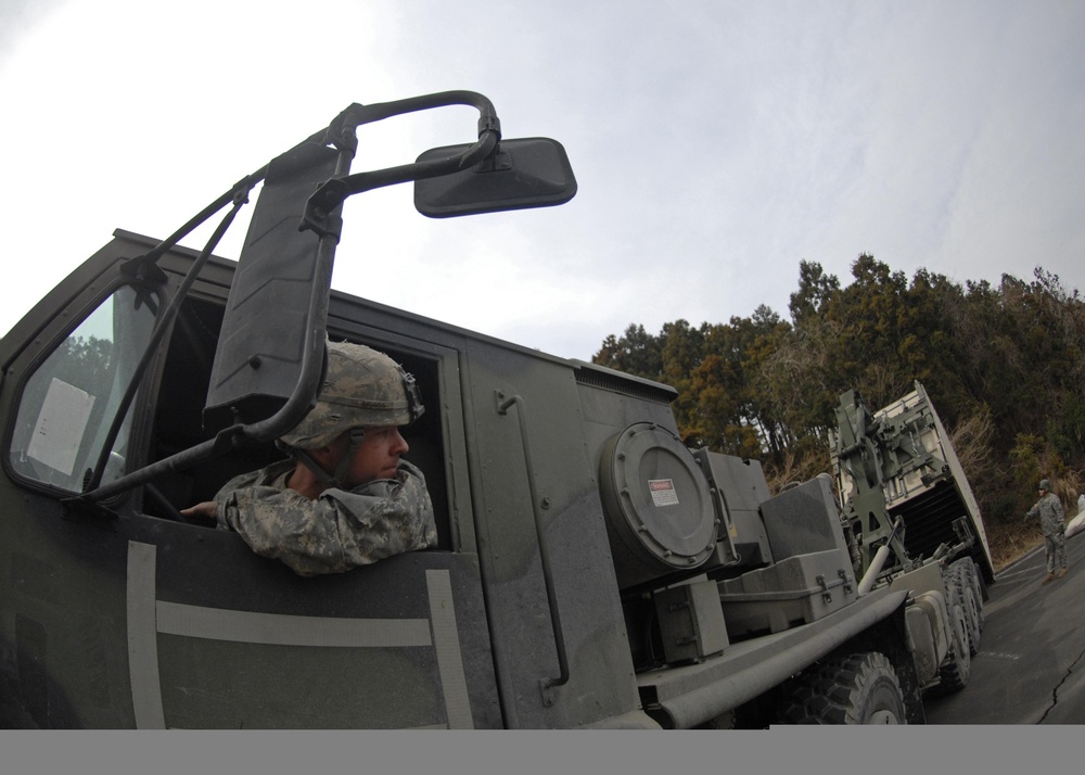 Washing it all away: soldiers, JSDF provide showers for tsunami victims