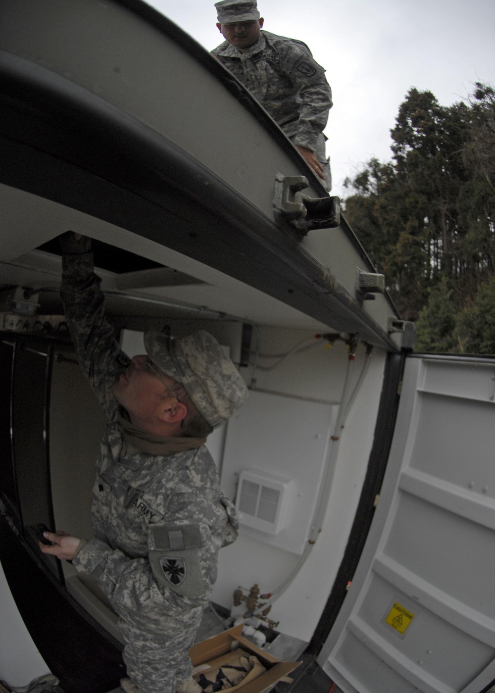 Washing it all away: soldiers, JSDF provide showers for tsunami victims