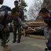 For the Children: soldiers give candy to tsunami victims