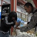 For the Children: soldiers give candy to tsunami victims