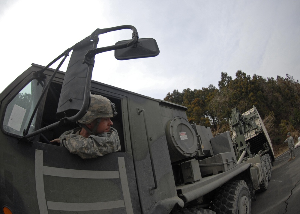 US Soldiers build showers for tsunami victims