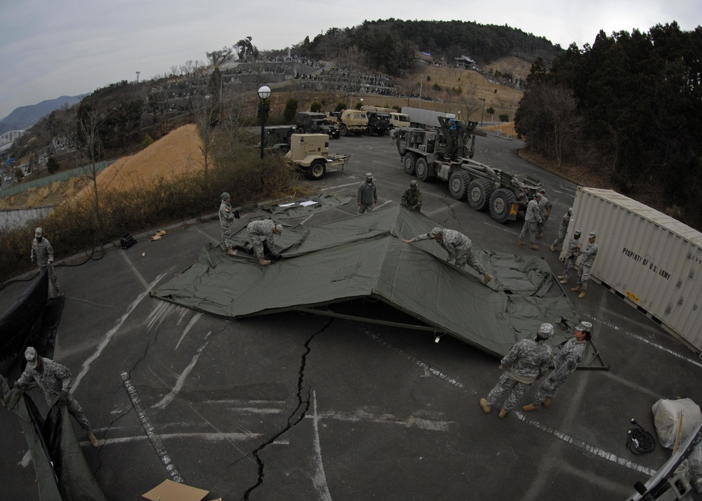 US Soldiers build showers for tsunami victims