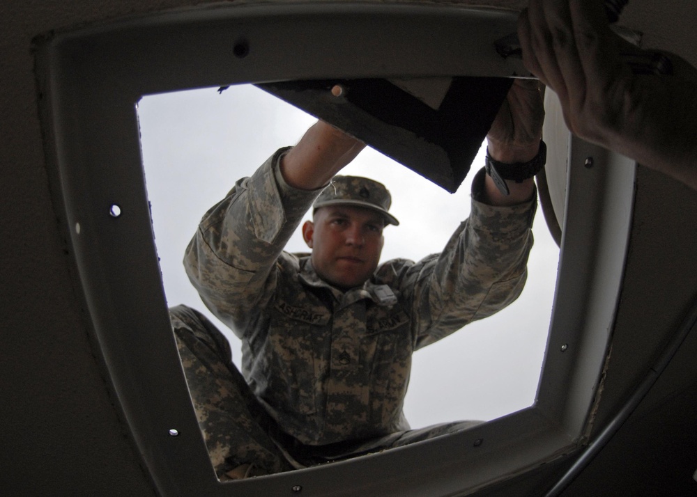 US soldiers build showers for tsunami victims
