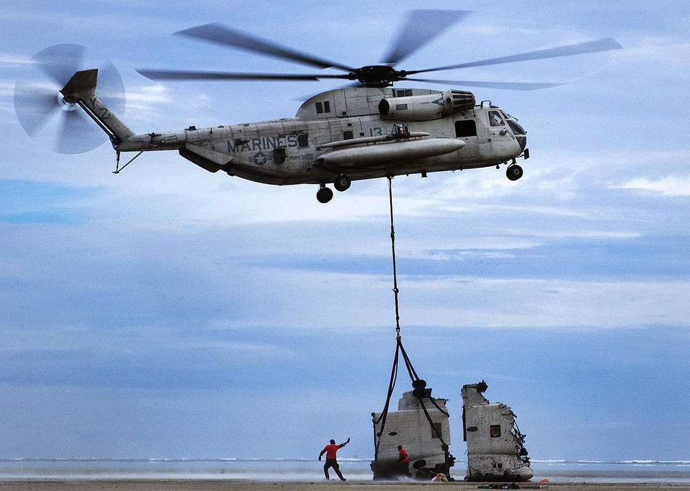 Helicopter lifts helicopter parts