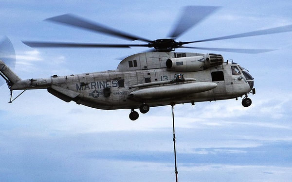 Helicopter lifts helicopter parts