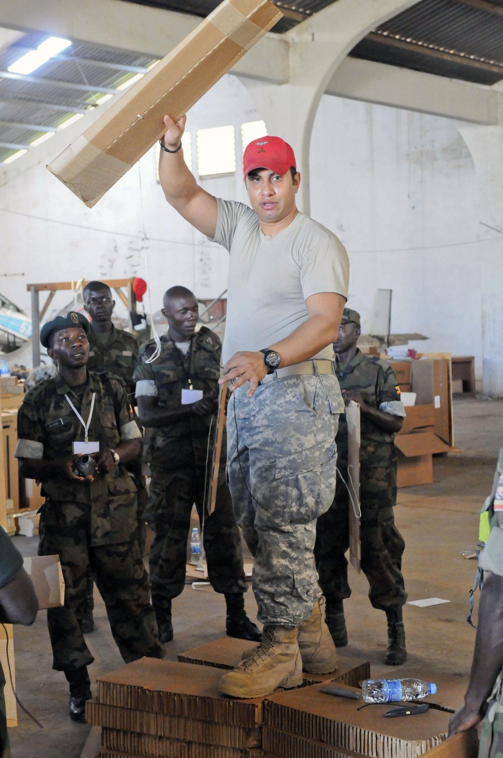 AD11 riggers prep chutes in tough conditions; train with Ugandans on aerial resupply