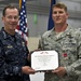 CJCS Navy Adm. Mike Mullen presents pararescuemen with bronze stars