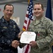 CJCS Navy Adm. Mike Mullen presents pararescuemen with bronze stars