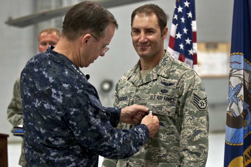 CJCS Navy Adm. Mike Mullen presents pararescuemen with bronze stars