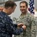 CJCS Navy Adm. Mike Mullen presents pararescuemen with bronze stars