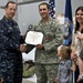 CJCS Navy Adm. Mike Mullen presents pararescuemen with bronze stars