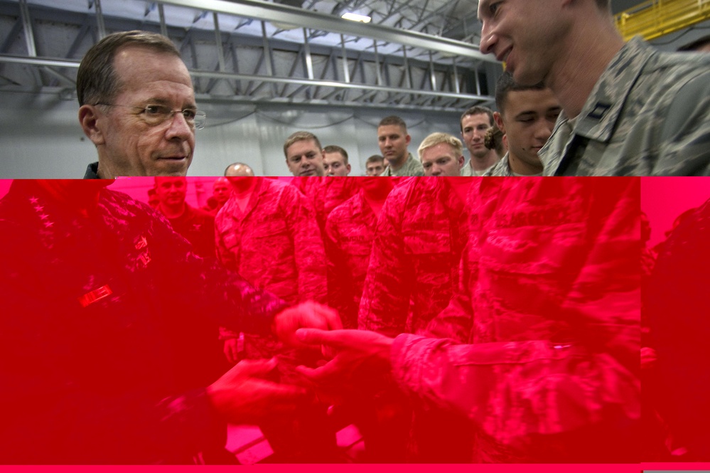 CJCS Navy Adm. Mike Mullen presents pararescuemen with bronze stars