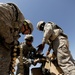 US Soldiers familiarize themselves with their weapons before missions.