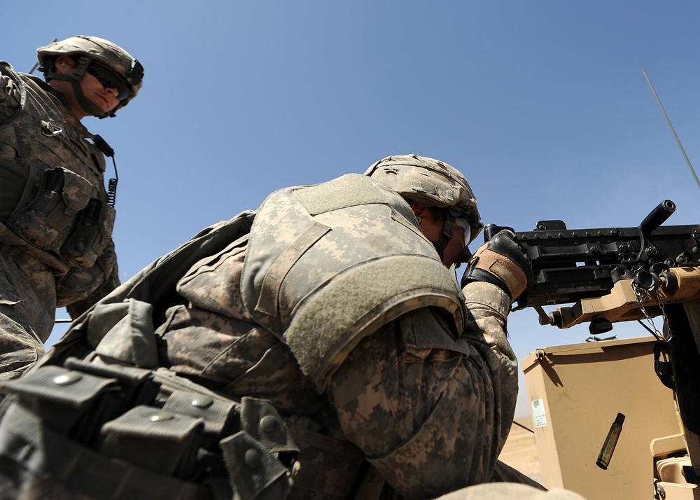 US Soldiers familiarize themselves with their weapons before missions.