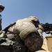 US Soldiers familiarize themselves with their weapons before missions.