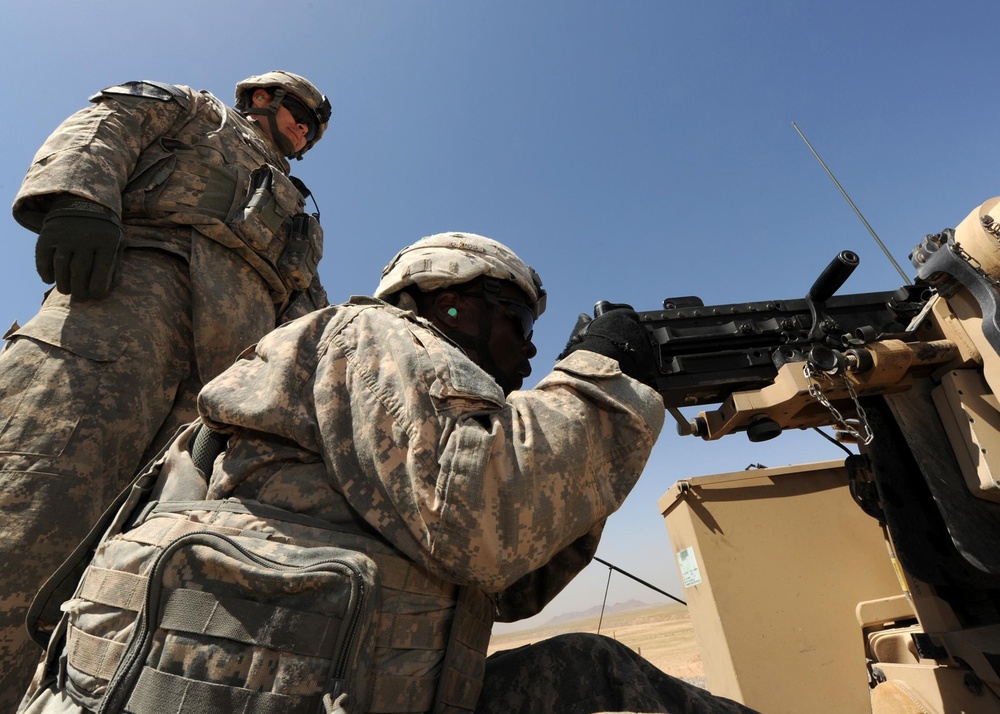 US Soldiers familiarize themselves with their weapons before missions.