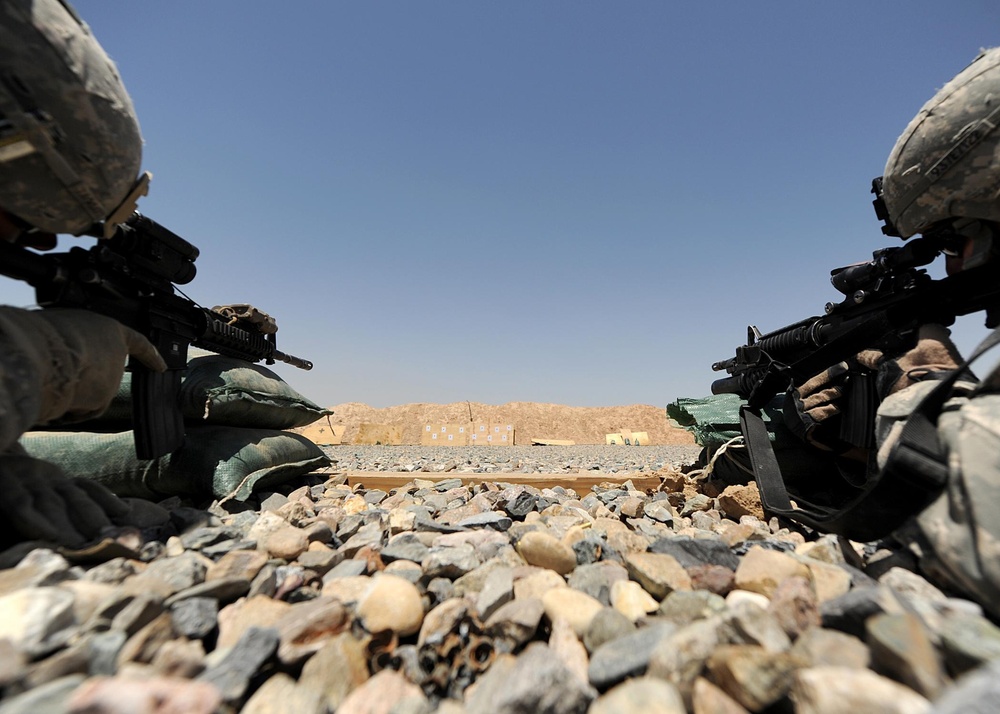 US Soldiers familiarize themselves with their weapons before missions.