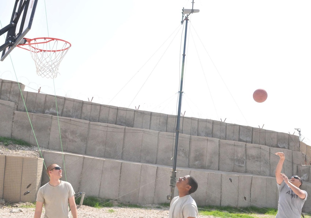 Soldiers shoot hoops in Ghormach
