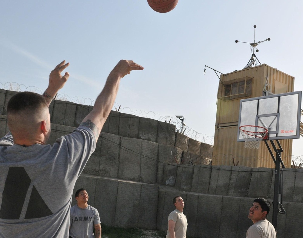 Soldiers shoot hoops in Ghormach
