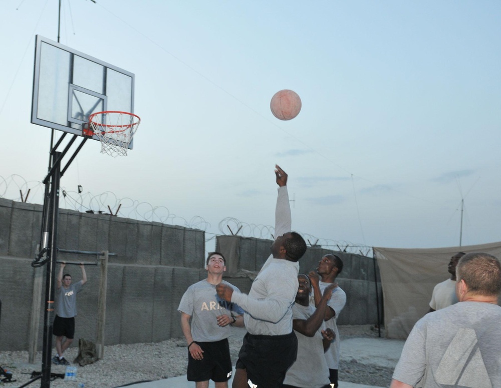 Soldiers shoot hoops in Ghormach