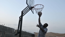 Soldiers shoot hoops in Ghormach