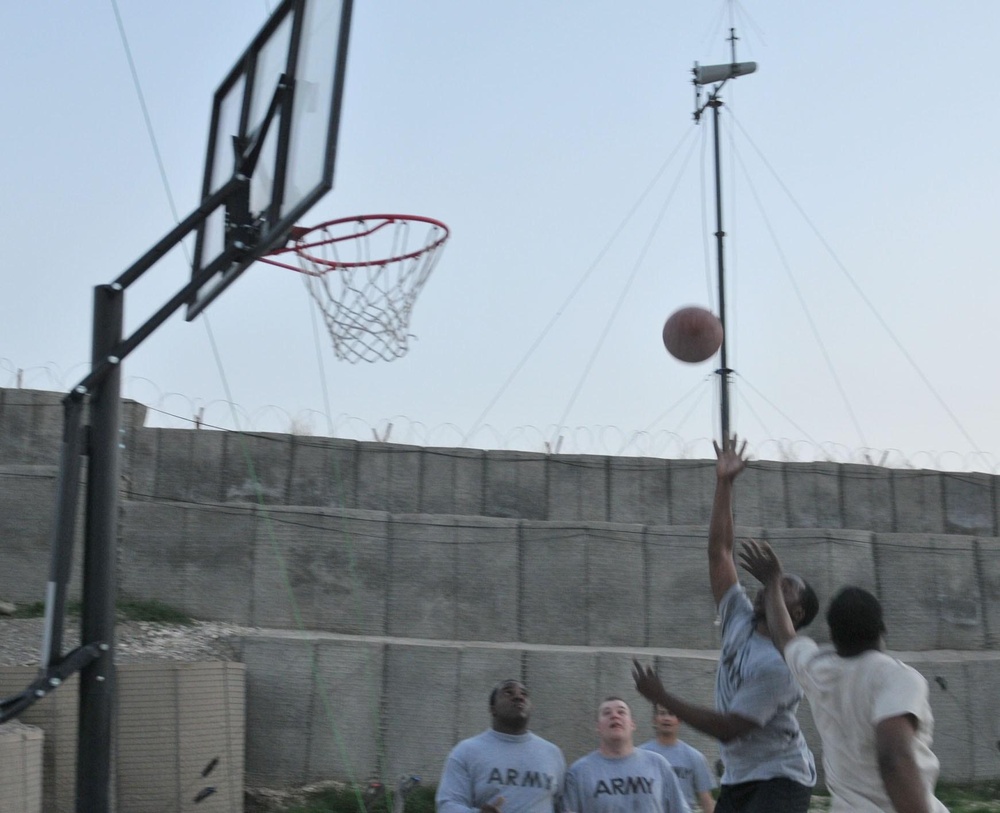 Soldiers shoot hoops in Ghormach