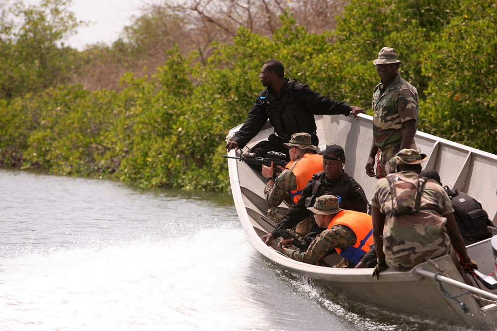 Senegalese, Nigerians special forces show Marines small boat amphibious tactics during APS-11