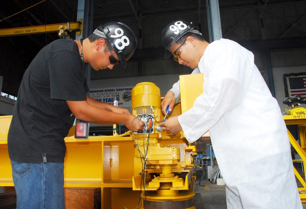PHNSY electrical apprentices inspect crane motor