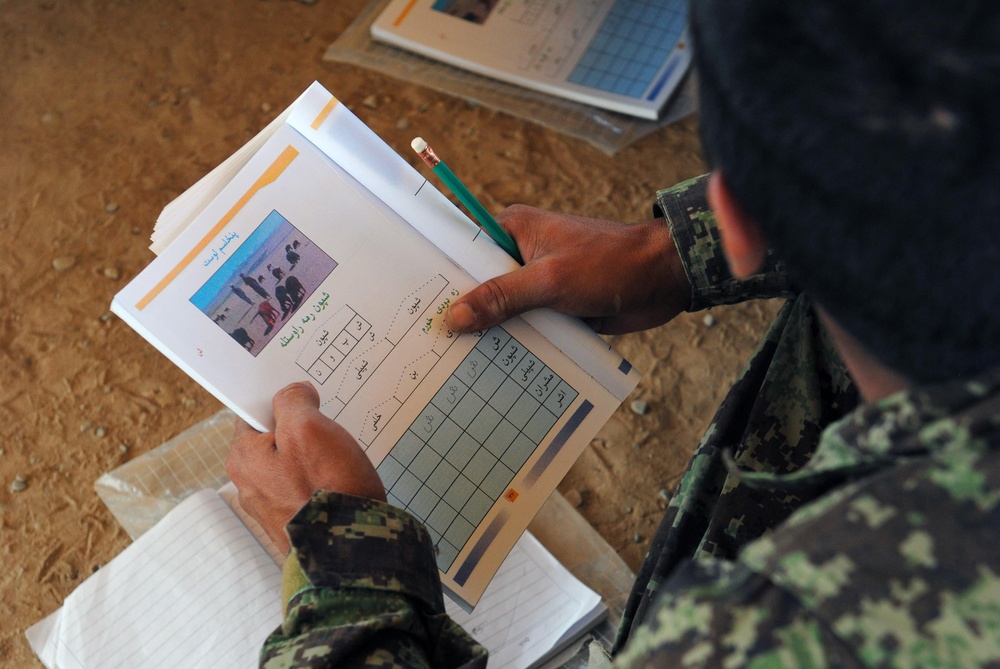 An Afghan National Army recruit studies