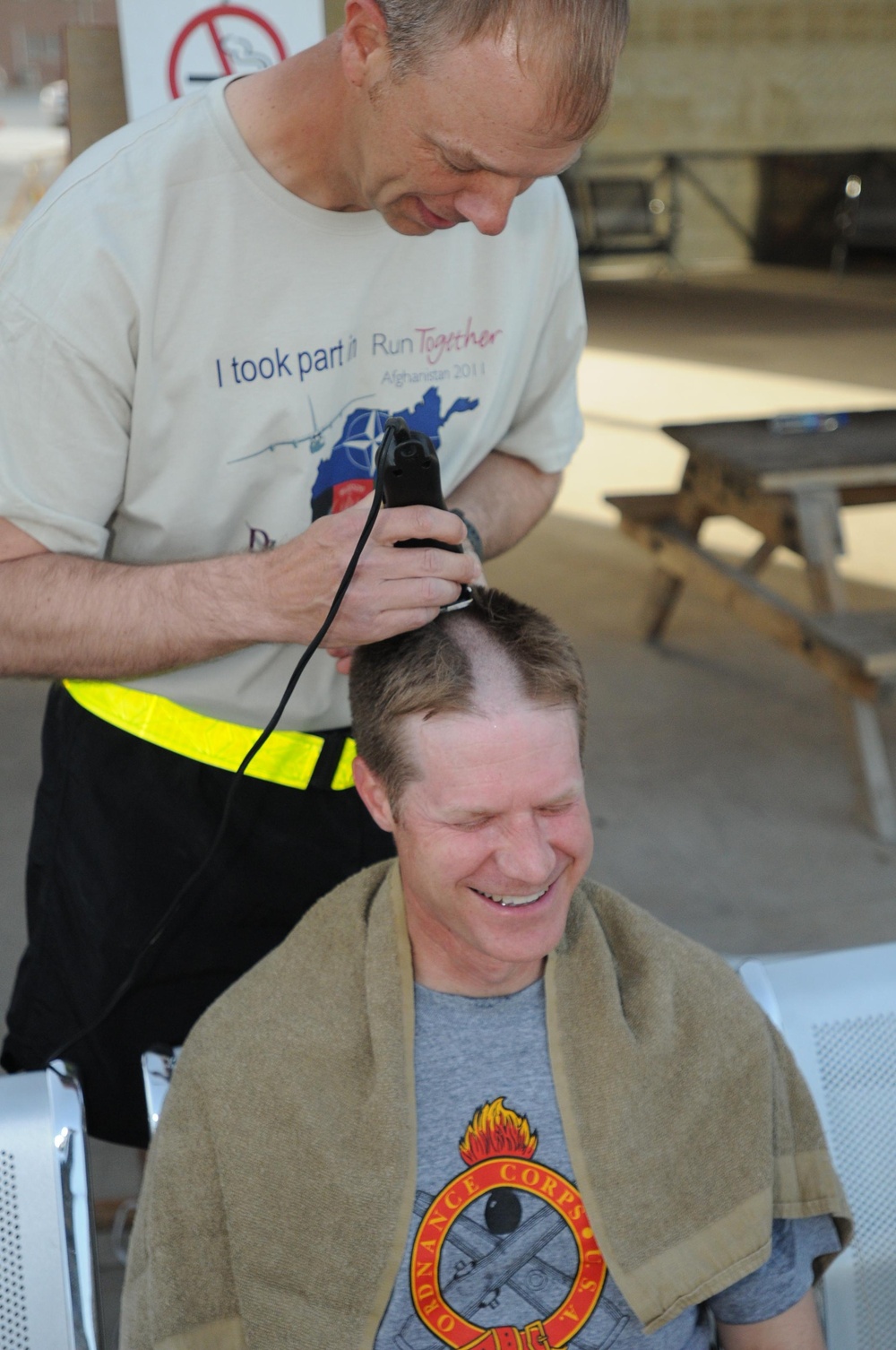 Going bald for UK cancer research at Kandahar Airfield, Afghanistan