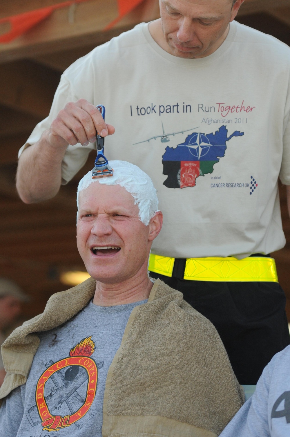 Going bald for UK cancer research at Kandahar Airfield, Afghanistan