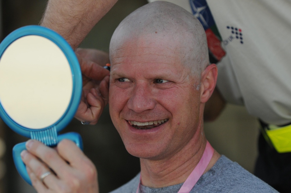 Going bald for UK cancer research at Kandahar Airfield, Afghanistan