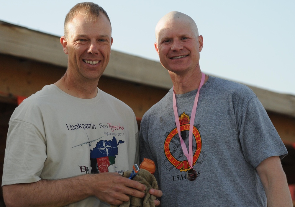 Going bald for UK cancer research at Kandahar Airfield, Afghanistan