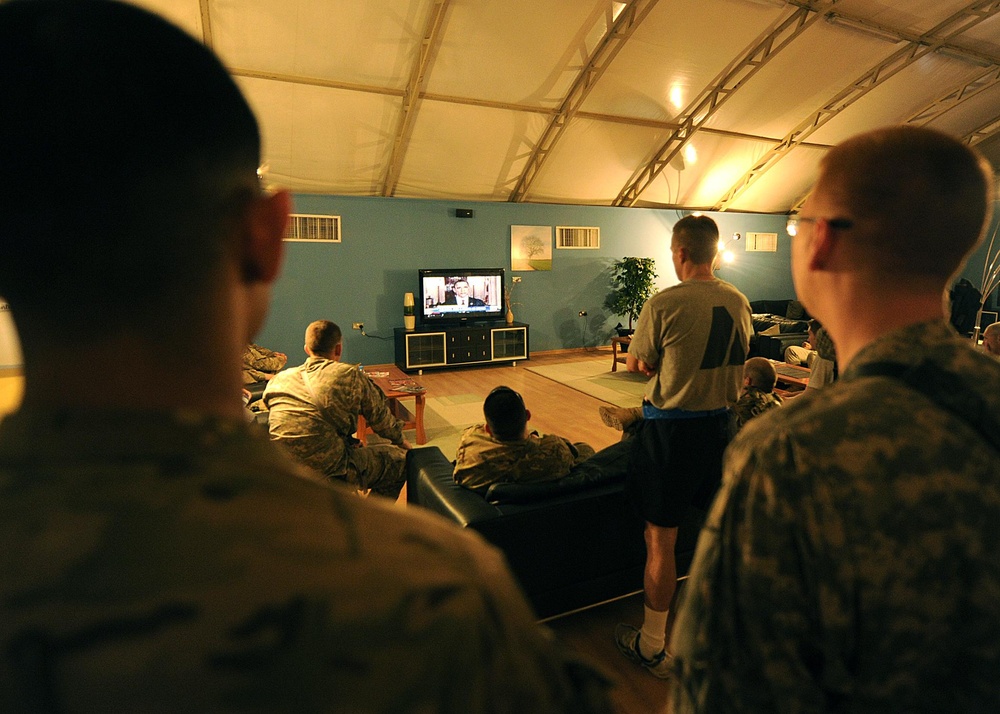 US service members watch President Obama give details of the death of 9/11 mastermind