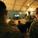 US service members watch President Obama give details of the death of 9/11 mastermind