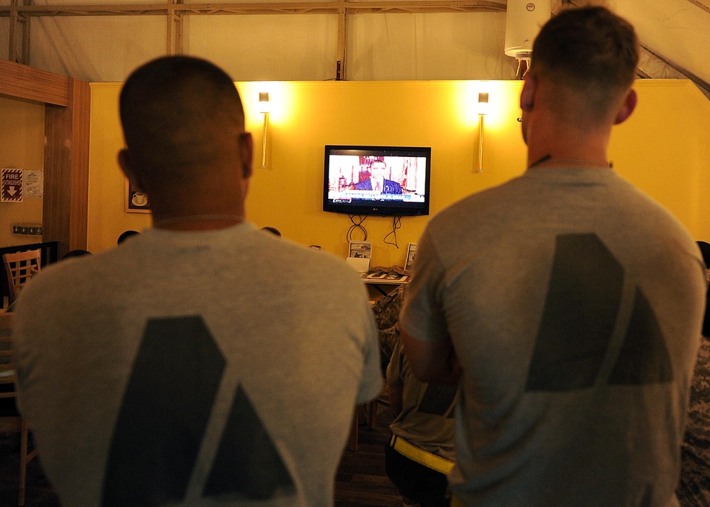 US service members watch President Obama give details of the death of 9/11 mastermind