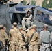 Soldiers and Airmen gathering around the apache longbow