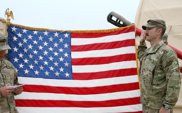 Reciting the Oath of Enlistment in a warzone