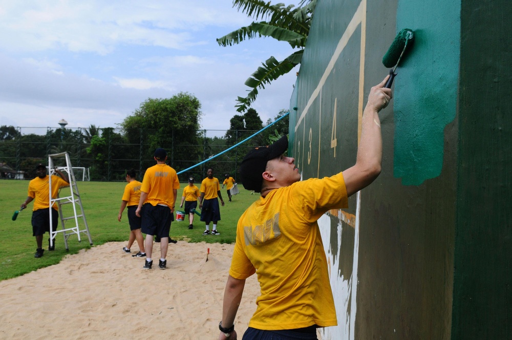Sailors and Marines play football with children in Thailand