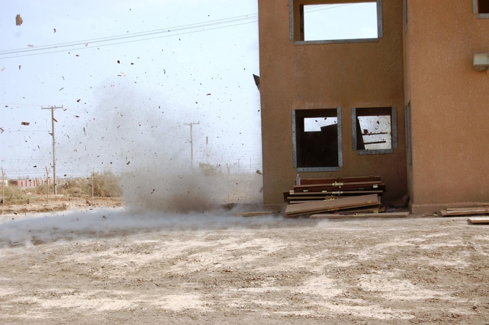 Engineers and infantrymen train together on how to secure a compound at Camp Taji, Iraq