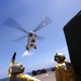 USS Whidbey Island sailor directs Puma helicopter