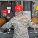 Bombs away: Airmen work together to build, load munitions