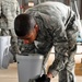 Bombs away: Airmen work together to build, load munitions
