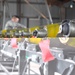 Bombs away: Airmen work together to build, load munitions