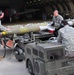 Bombs away: Airmen work together to build, load munitions