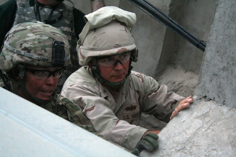 Seabees repair security wall at Camp Nathan Smith