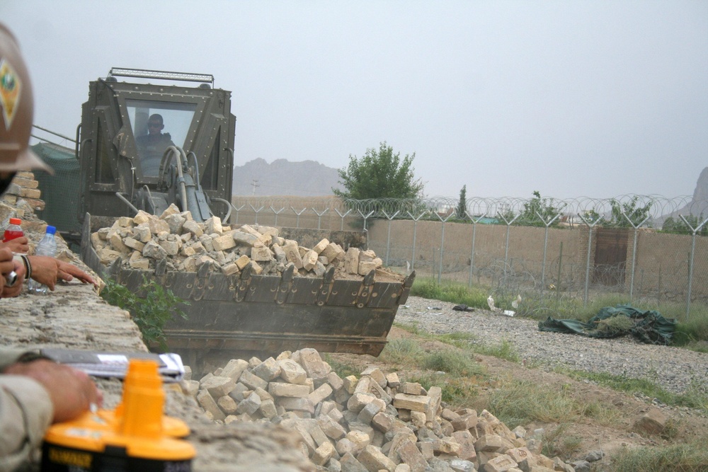 Seabees repair security wall at Camp Nathan Smith